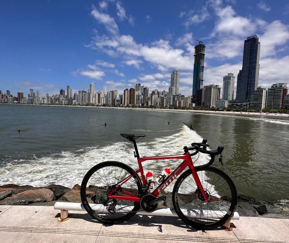 Road bike on the waterfront in southern Brazil with city skyline and ocean behind