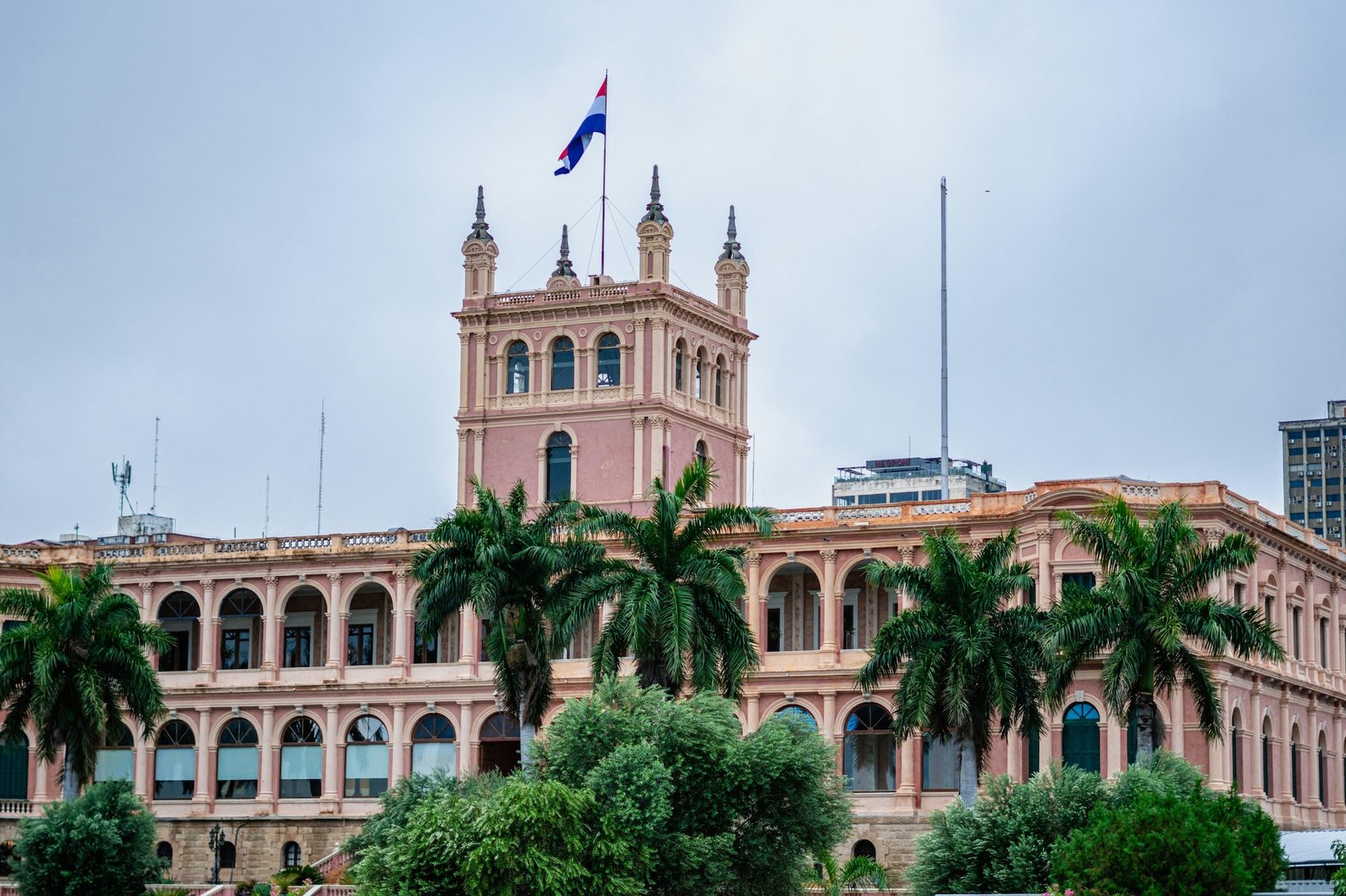 The pink neoclassical Palacio de López with the Paraguayan flag flying above, Asunción