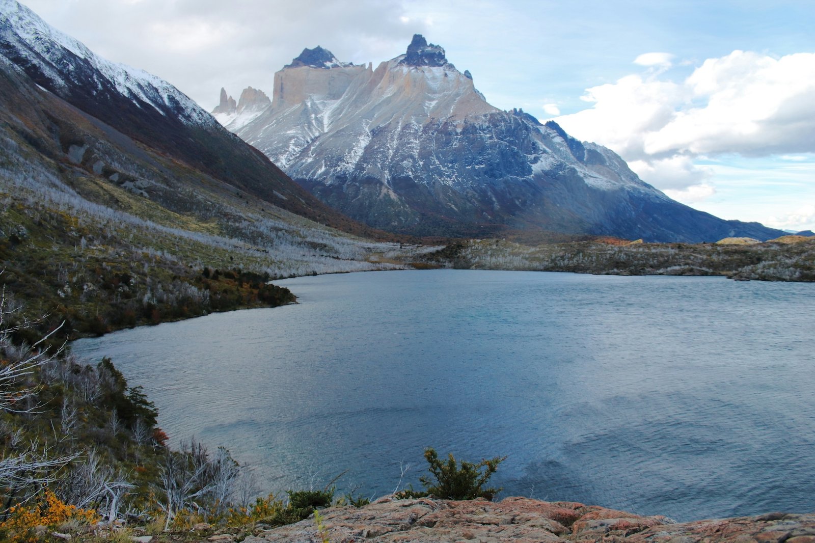 Granite towers of Torres del Paine rising above a turquoise lake in Chilean Patagonia